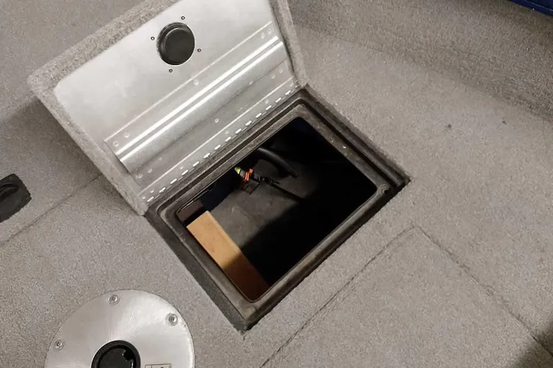 Slide: The Image of Open storage compartment in 2013 Tracker Pro Guide V-16 WT boat interior. - 16