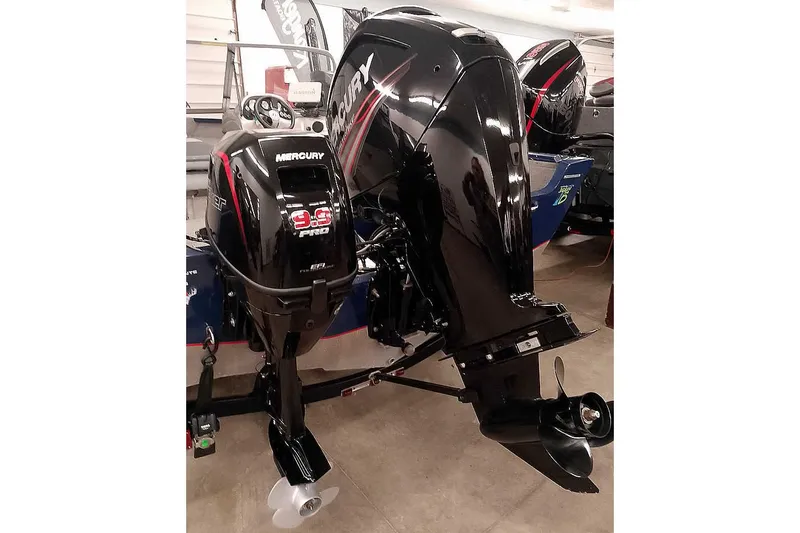 Slide: The Image of 2013 Tracker Pro Guide V-16 WT boat with Mercury 9.9 Pro outboard motor. - 2