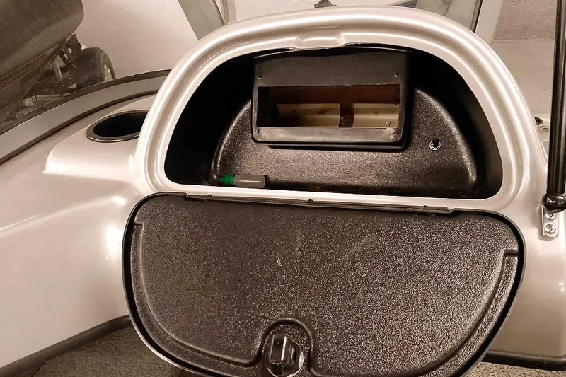 Slide: The Image of Open storage compartment in 2013 Tracker Pro Guide V-16 WT boat. - 23