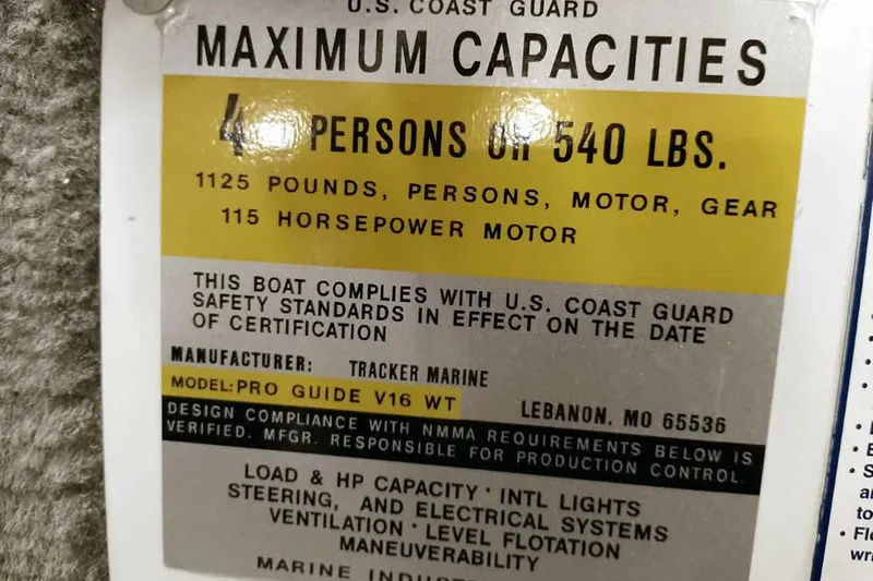 Slide: The Image of 2013 Tracker Pro Guide V-16 WT capacity label, 4 persons, 540 lbs, 115 horsepower. - 25