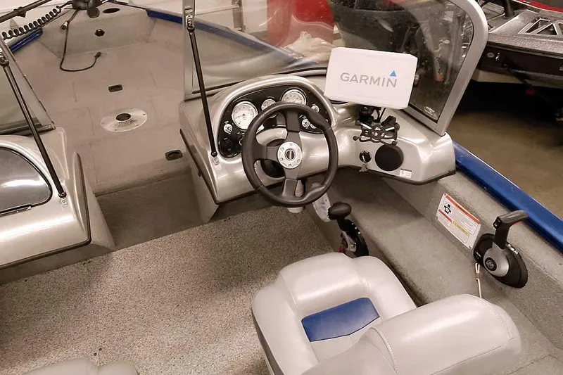 Slide: The Image of 2013 Tracker Pro Guide V-16 WT boat interior with Garmin navigation system. - 26