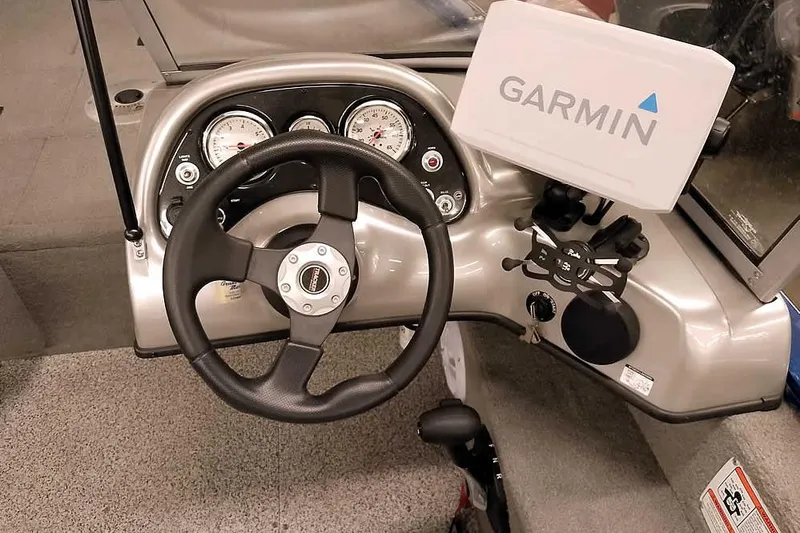 Slide: The Image of 2013 Tracker Pro Guide V-16 WT dashboard with Garmin navigation system. - 27