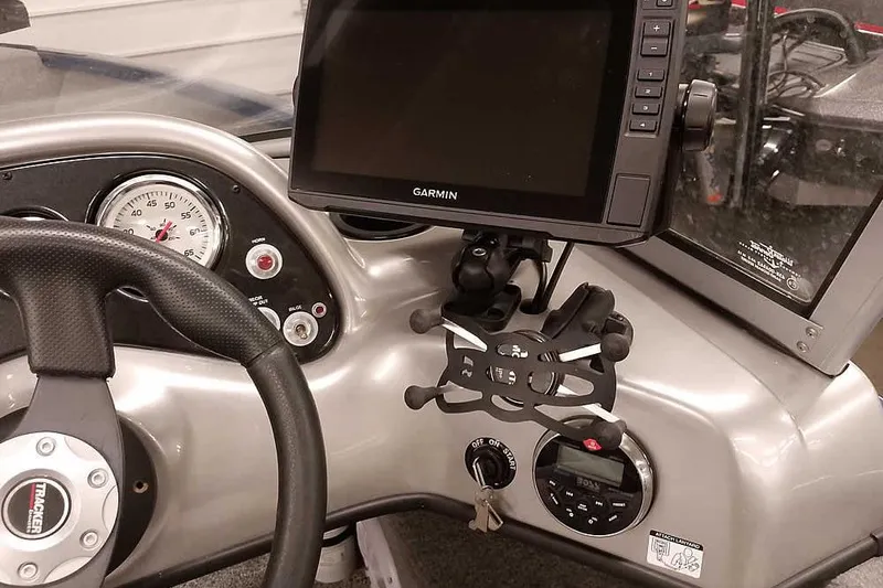 Slide: The Image of Dashboard of a 2013 Tracker Pro Guide V-16 WT with Garmin GPS and steering wheel. - 28
