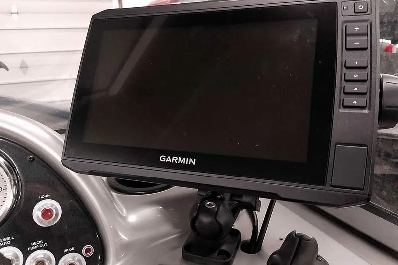 Slide: The Image of Garmin GPS device on 2013 Tracker Pro Guide V-16 WT boat dashboard. - 29
