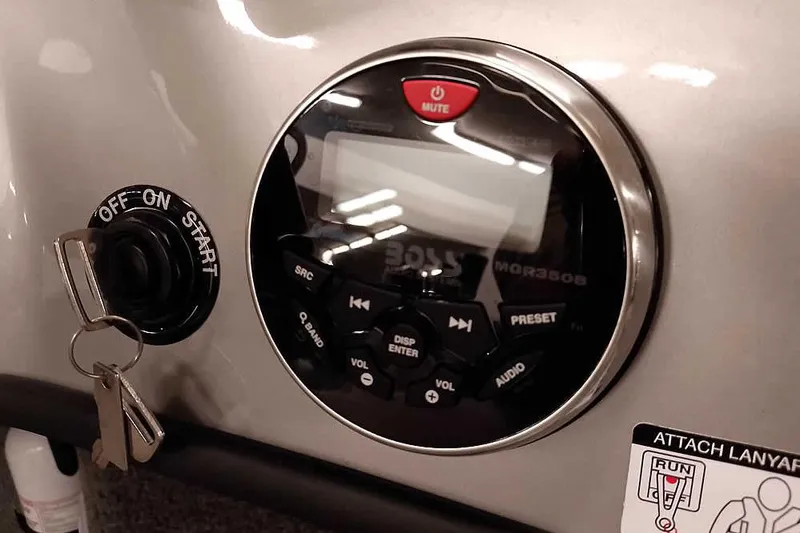 Slide: The Image of Control panel of a 2013 Tracker Pro Guide V-16 WT boat with ignition and audio system. - 30