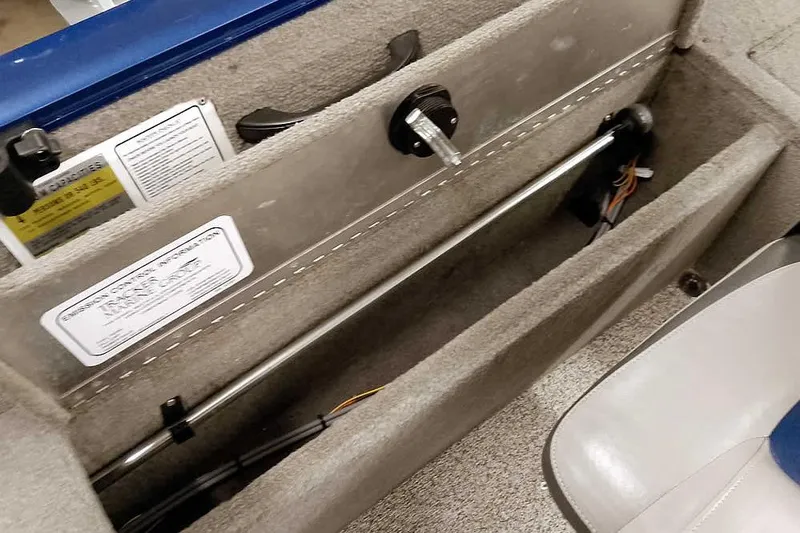 Slide: The Image of Interior view of a 2013 Tracker Pro Guide V-16 WT boat compartment. - 32
