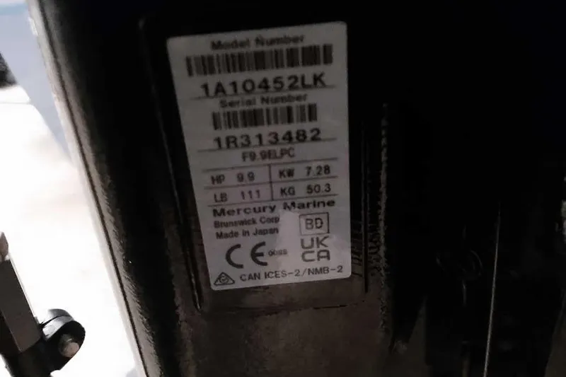 Slide: The Image of Label on a 2013 Tracker Pro Guide V-16 WT boat engine, showing specifications and serial numbers. - 5