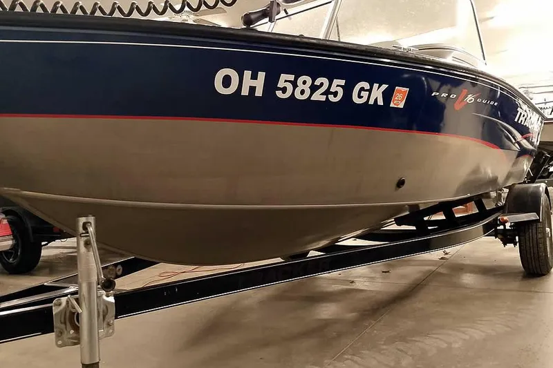 Slide: The Image of 2013 Tracker Pro Guide V-16 WT boat on trailer, registration OH 5825 GK. - 7
