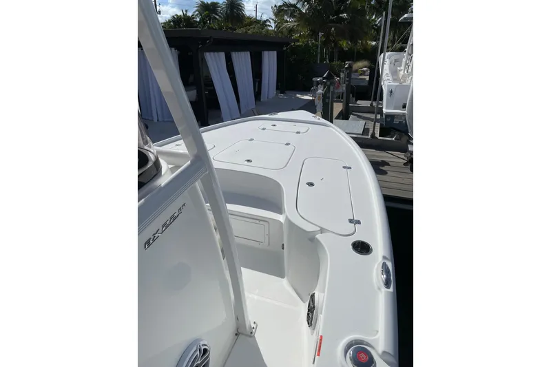 Slide: The Image of 2024 Sea Hunt BX 22 BR boat deck, featuring sleek design and spacious layout. - 11