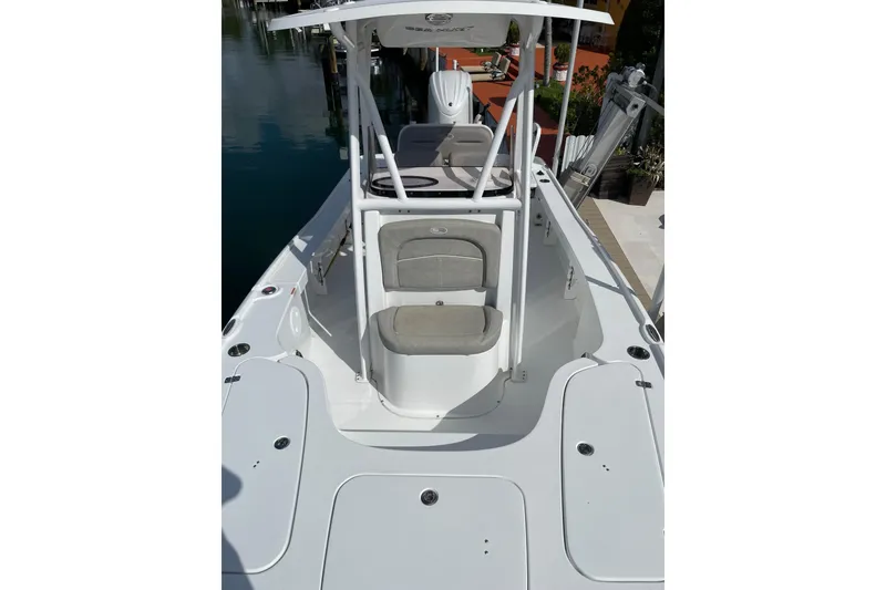 Slide: The Image of 2024 Sea Hunt BX 22 BR boat with sleek white deck and seating. - 12
