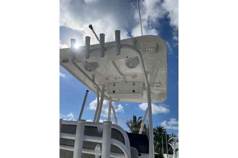 Slide: The Image of 2024 Sea Hunt BX 22 BR boat T-top under a sunny sky. - 8