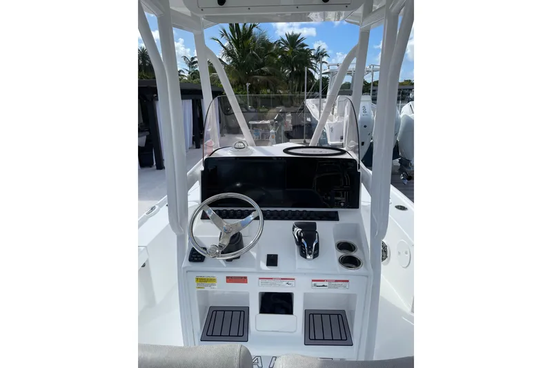 Slide: The Image of 2024 Sea Hunt BX 22 BR boat console with steering wheel and controls. - 9
