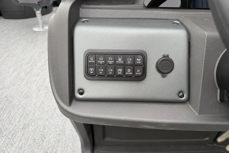 Slide: The Image of Control panel of 2026 Sun Tracker Fishin' Barge 20 DLX with USB port and switches. - 19