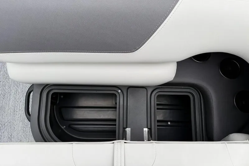 Slide: The Image of 2026 Sun Tracker Fishin' Barge 20 DLX storage compartments and seating detail. - 22