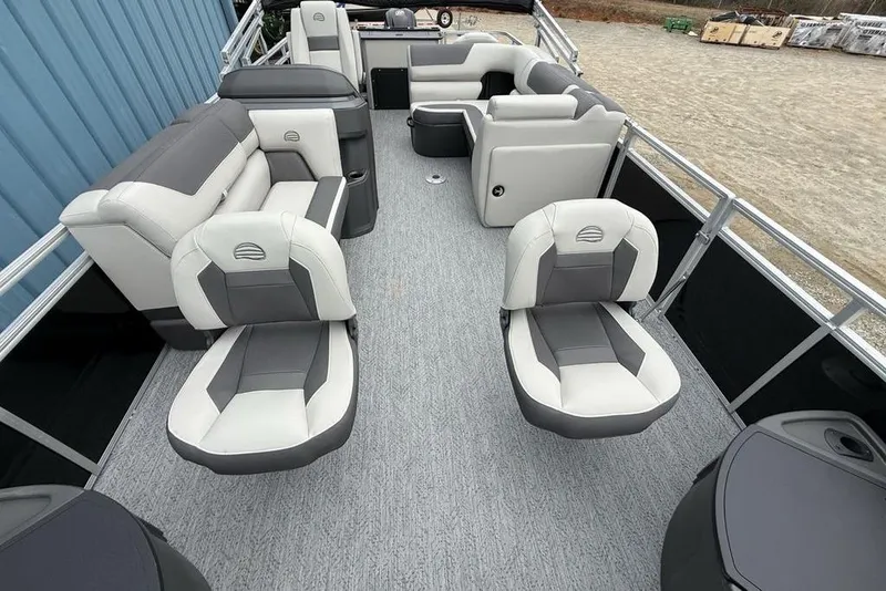 Slide: The Image of 2026 Sun Tracker Fishin' Barge 20 DLX interior with gray and white seating. - 28