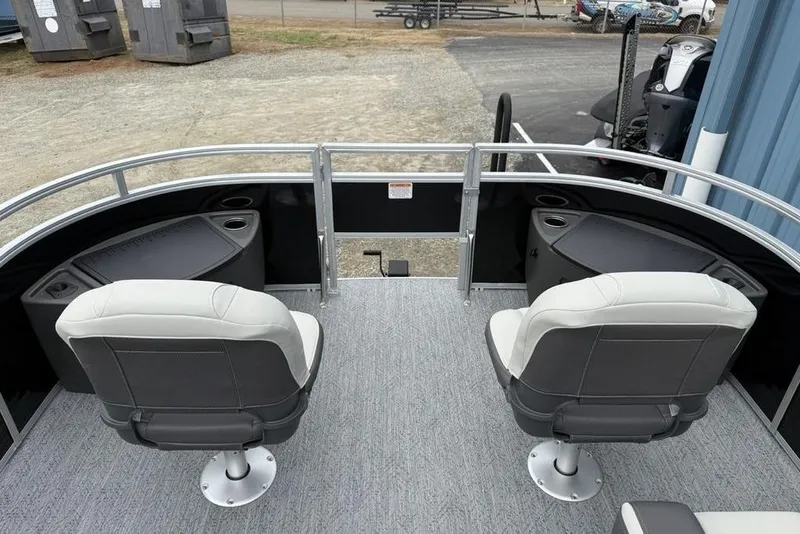 Slide: The Image of 2026 Sun Tracker Fishin' Barge 20 DLX with two swivel seats and storage compartments. - 4