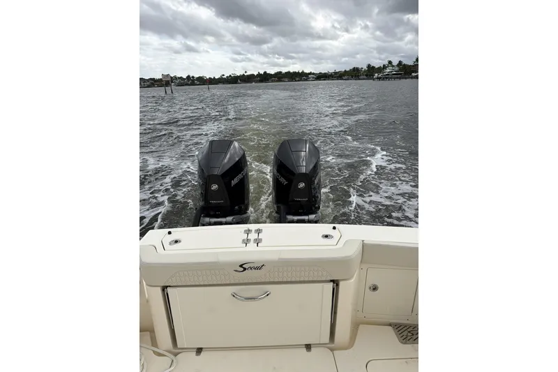 Slide: The Image of 2026 Scout 288 LXF boat with dual Mercury engines on water. - 4