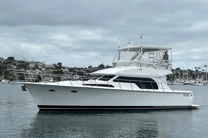 Slide: The Image of 2021 Mikelson Gen II 43 SF yacht on calm water, overcast sky background. - 1