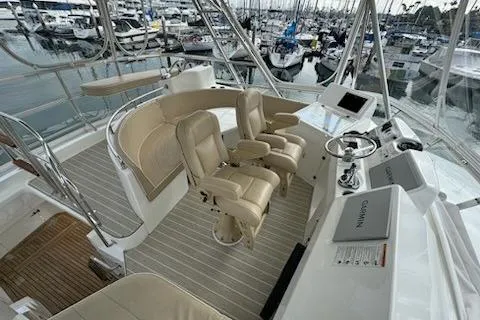 Slide: The Image of 2021 Mikelson Gen II 43 SF yacht cockpit with beige seating and modern controls. - 13