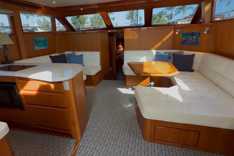 Slide: The Image of Luxurious interior of 2021 Mikelson Gen II 43 SF yacht with plush seating and elegant wood finishes. - 5