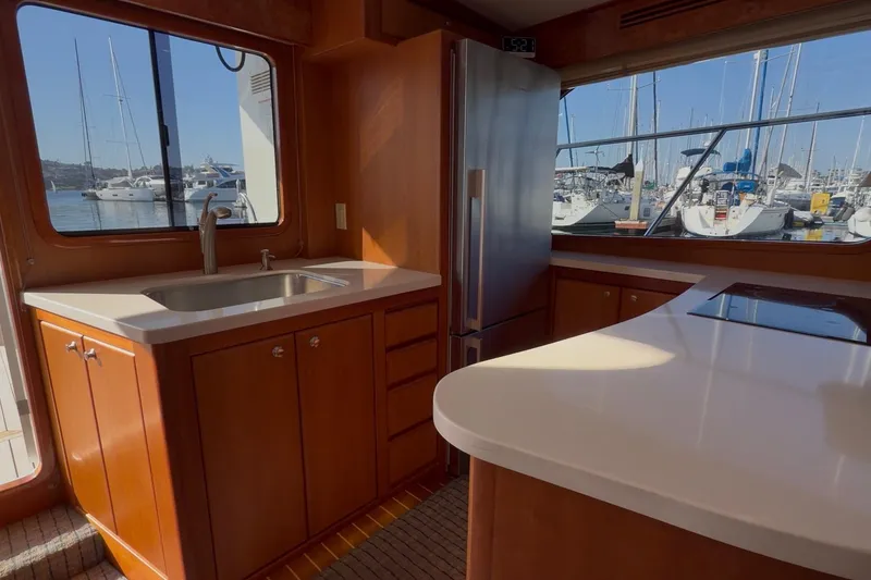 Slide: The Image of Luxurious kitchen interior of 2021 Mikelson Gen II 43 SF yacht with marina view. - 6
