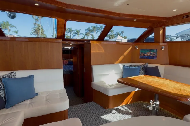 Slide: The Image of Luxurious interior of 2021 Mikelson Gen II 43 SF yacht with plush seating and wooden accents. - 7