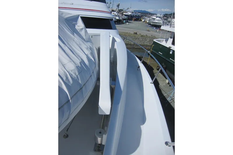Slide: The Image of 1999 Delta Marine Raised Pilothouse Motoryacht deck view at marina. - 11