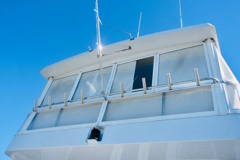 Slide: The Image of Raised pilothouse of 1999 Delta Marine Motoryacht against clear blue sky. - 12