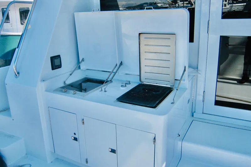 Slide: The Image of Outdoor kitchen on a 1999 Delta Marine Raised Pilothouse Motoryacht. - 20