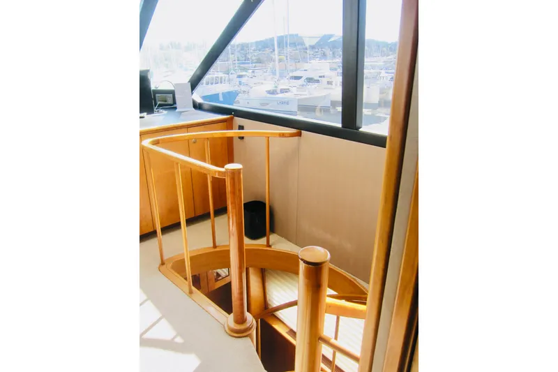Slide: The Image of Interior of 1999 Delta Marine Raised Pilothouse Motoryacht with wooden spiral staircase. - 33