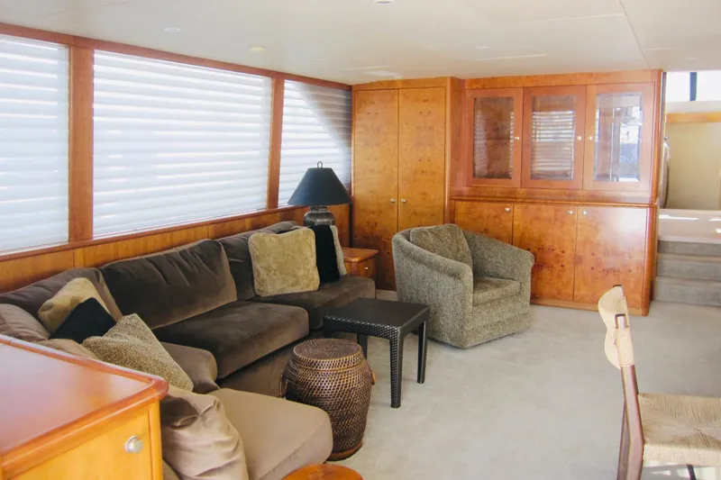 Slide: The Image of Luxurious interior of 1999 Delta Marine Raised Pilothouse Motoryacht with plush seating and wood cabinetry. - 37