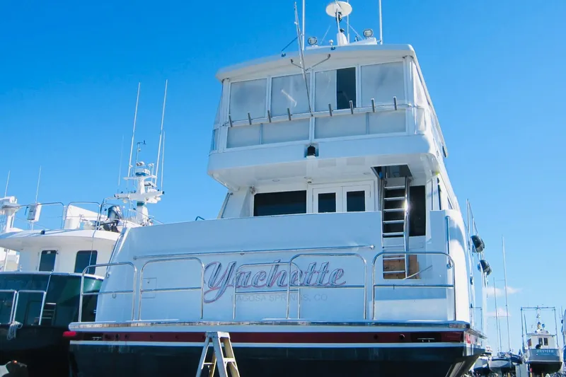 Slide: The Image of Delta Marine 1999 Raised Pilothouse Motoryacht docked under clear blue sky. - 4