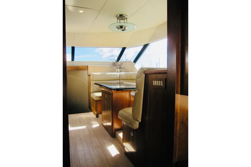 Slide: The Image of Luxurious interior of 1999 Delta Marine Raised Pilothouse Motoryacht with elegant seating and table. - 45