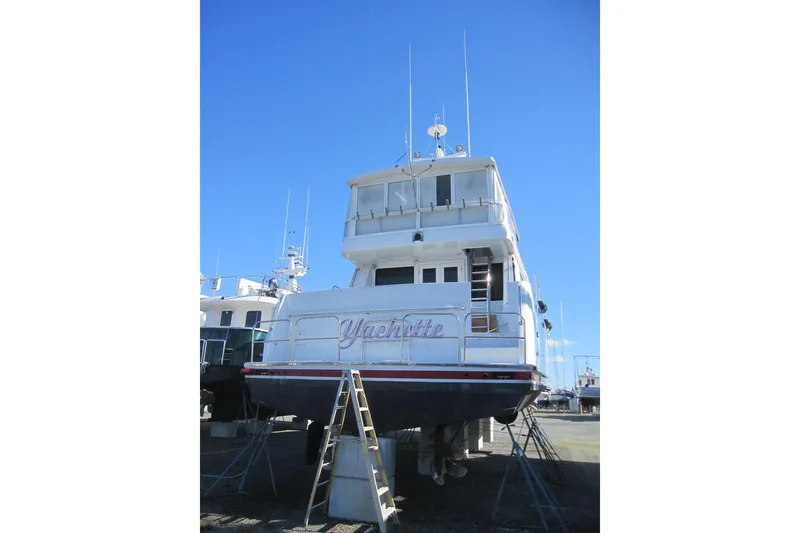 Slide: The Image of 1999 Delta Marine Raised Pilothouse Motoryacht on dry dock under clear blue sky. - 5