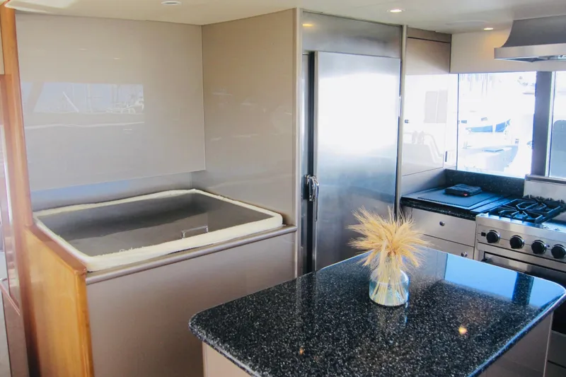 Slide: The Image of Luxurious kitchen interior of 1999 Delta Marine Raised Pilothouse Motoryacht with modern appliances. - 50