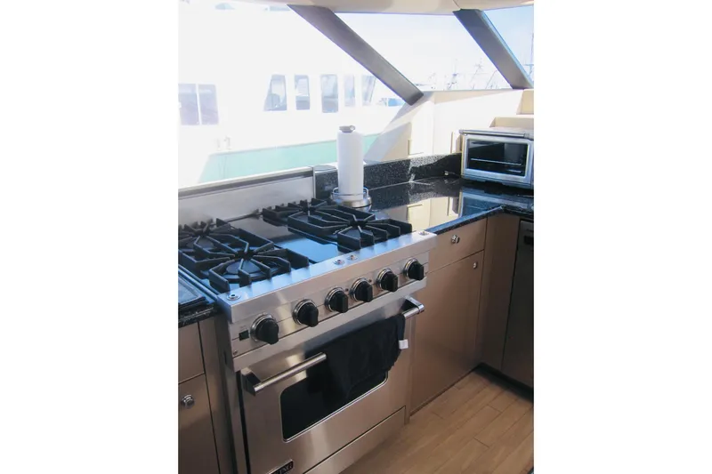 Slide: The Image of Luxurious yacht kitchen with modern stove and sleek countertops, Delta Marine 1999 model. - 52