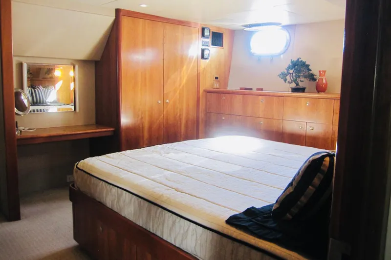 Slide: The Image of Luxurious bedroom interior of 1999 Delta Marine Raised Pilothouse Motoryacht with wood furnishings. - 57