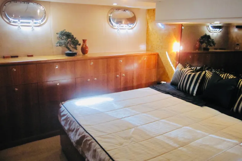 Slide: The Image of Luxurious bedroom interior of 1999 Delta Marine Raised Pilothouse Motoryacht with elegant wood cabinetry. - 59