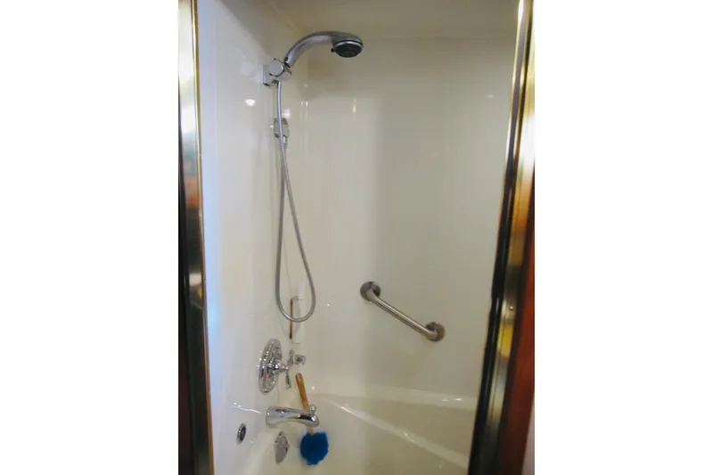 Slide: The Image of Shower area in 1999 Delta Marine Raised Pilothouse Motoryacht with chrome fixtures. - 62