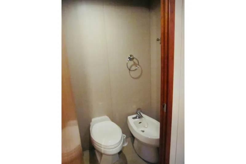 Slide: The Image of Bathroom with toilet and bidet on 1999 Delta Marine Raised Pilothouse Motoryacht. - 63