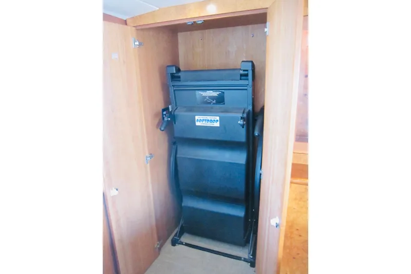 Slide: The Image of Foldable treadmill in wooden cabinet on 1999 Delta Marine yacht. - 67
