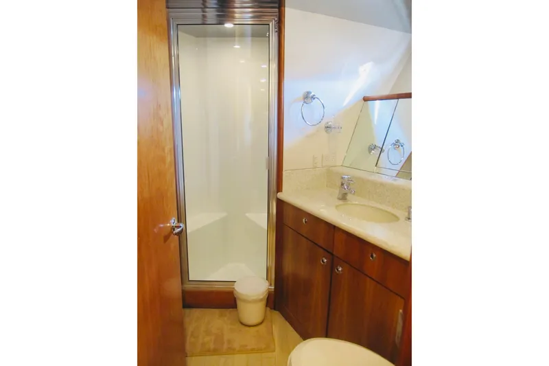 Slide: The Image of Luxurious bathroom in 1999 Delta Marine Raised Pilothouse Motoryacht with shower and wooden cabinetry. - 71
