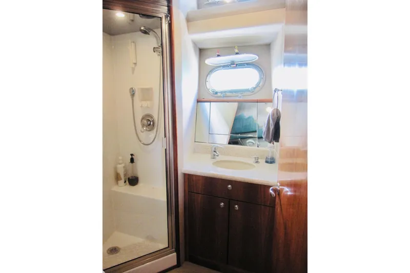 Slide: The Image of Luxurious bathroom in 1999 Delta Marine Raised Pilothouse Motoryacht with shower and vanity. - 73