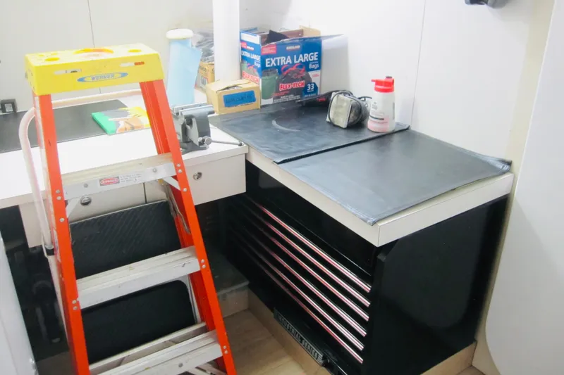 Slide: The Image of Workshop area on a 1999 Delta Marine Raised Pilothouse Motoryacht with ladder and toolbox. - 79