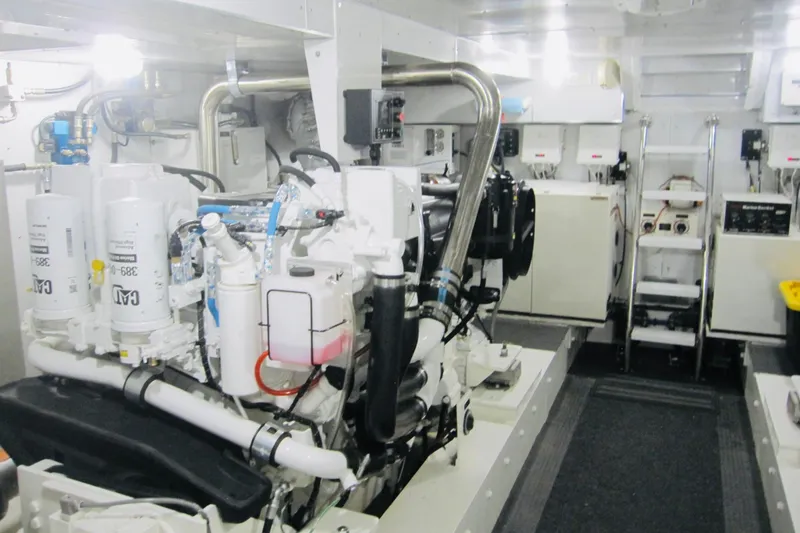 Slide: The Image of Engine room of 1999 Delta Marine Raised Pilothouse Motoryacht, showcasing machinery and equipment. - 81