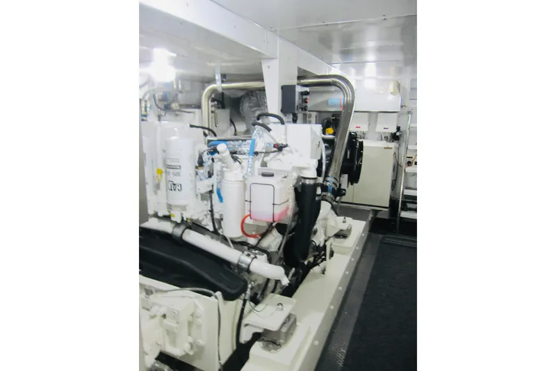 Slide: The Image of Engine room of 1999 Delta Marine Raised Pilothouse Motoryacht, showcasing machinery and equipment. - 83