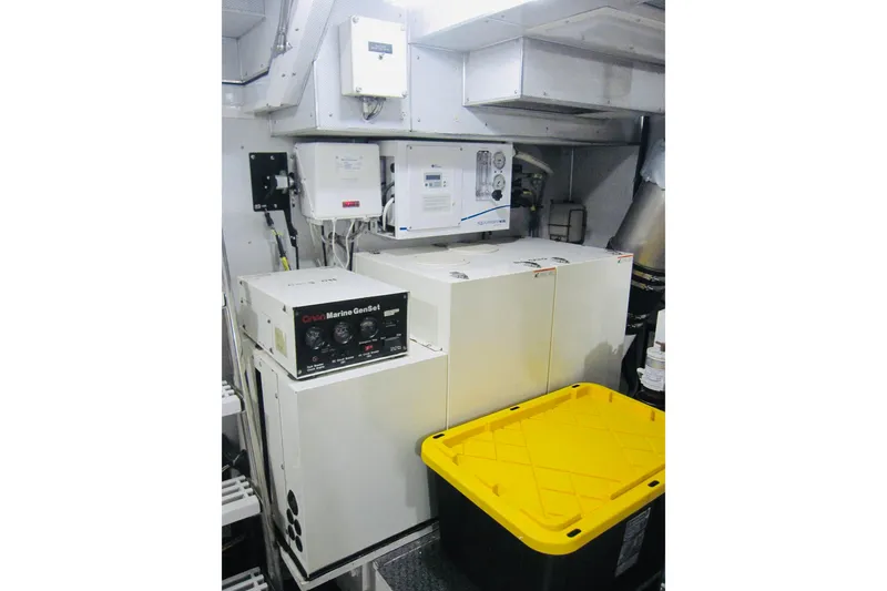 Slide: The Image of Engine room of 1999 Delta Marine Raised Pilothouse Motoryacht with generator and equipment. - 85