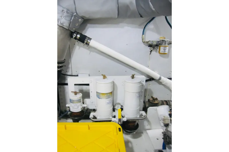 Slide: The Image of Engine room of 1999 Delta Marine Raised Pilothouse Motoryacht with filtration system. - 88