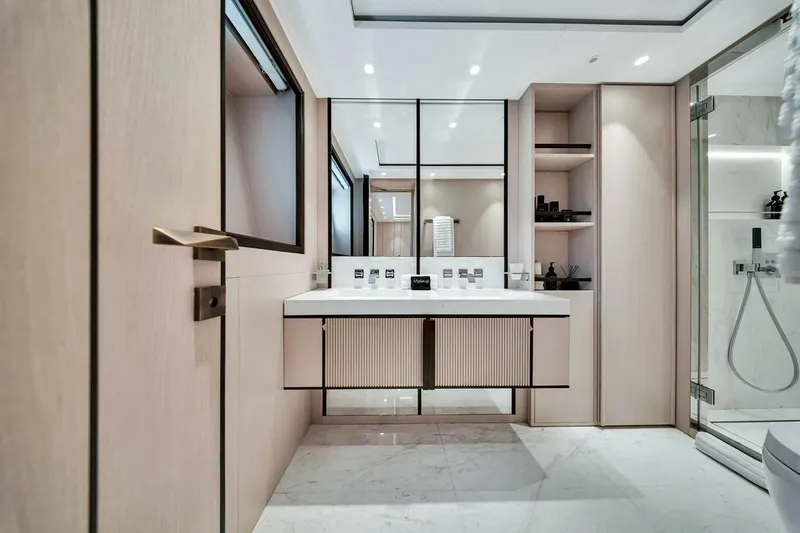 Slide: The Image of Luxurious bathroom interior of 2024 Baglietto DOM 133 yacht, featuring modern fixtures and elegant design. - 100