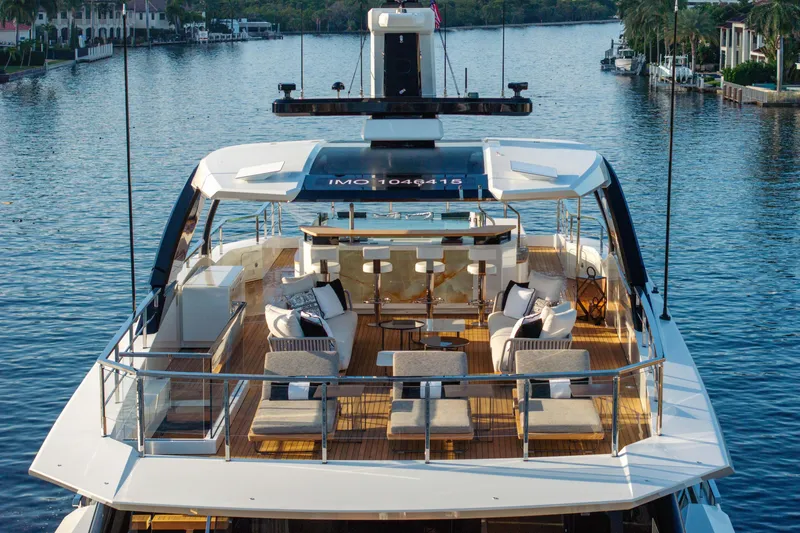 Slide: The Image of Luxurious 2024 Baglietto DOM 133 yacht with elegant deck and seating area. - 11